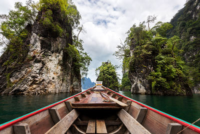 Boat over sea against mountain