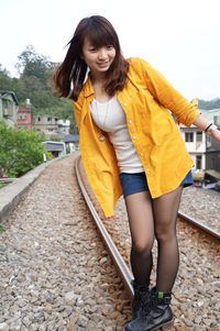 Portrait of smiling young woman outdoors