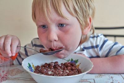 Close-up of cute boy eating food