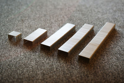 High angle view of stapler pins on table