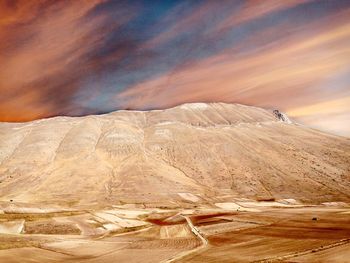 Scenic view of desert against sky