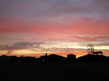 Silhouette of built structure at sunset