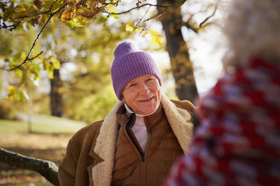 Smiling senior man looking away