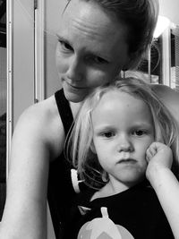 Portrait of mother and daughter outdoors