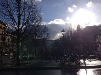 Silhouette of buildings against cloudy sky