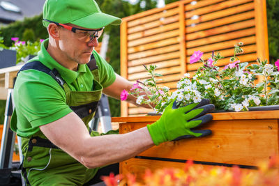 Side view of man working at farm