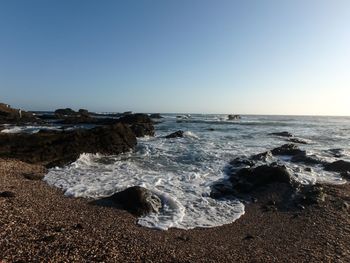 Scenic view of sea against clear sky
