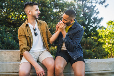 Young couple sitting outdoors