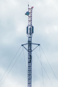 Low angle view of electricity pylon against sky