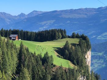 Scenic view of landscape and mountains against sky