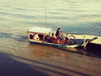 People on boat in river