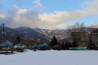 Scenic view of snowcapped mountains against sky during winter