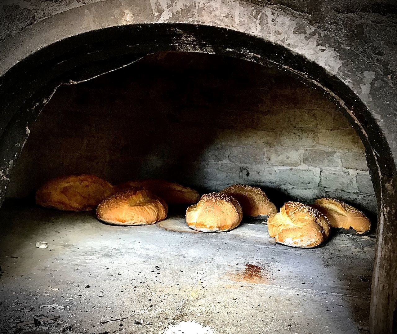 food, food and drink, darkness, no people, indoors, oven, freshness, cave, masonry oven, bread, still life, appliance, healthy eating, baking bread, wellbeing, close-up, baked