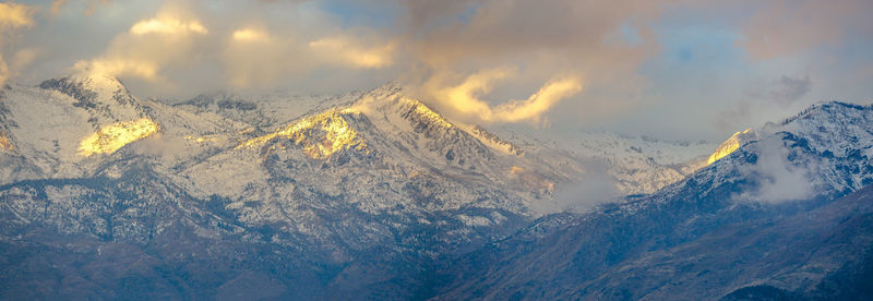 Scenic view of snowcapped mountains against sky during winter