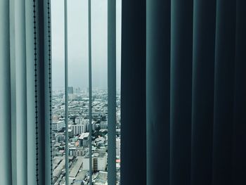 City buildings seen through window