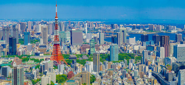 Aerial view of modern buildings in city against sky