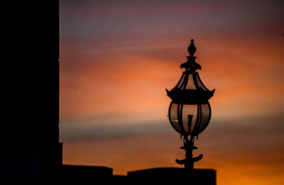 Low angle view of illuminated building against sky at night
