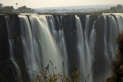 Panoramic view of waterfall in forest