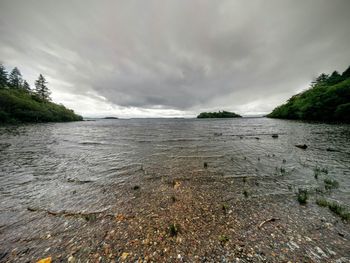 Scenic view of sea against cloudy sky