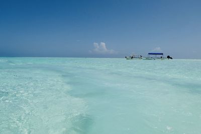 Scenic view of sea against blue sky