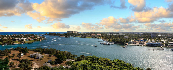 High angle view of buildings and sea against sky