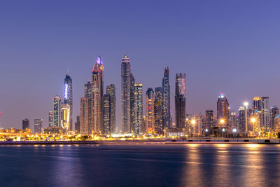 Amazing dubai marina and famous jumeirah beach at sunset, united arab emirates