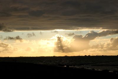 Silhouette landscape against sky during sunset