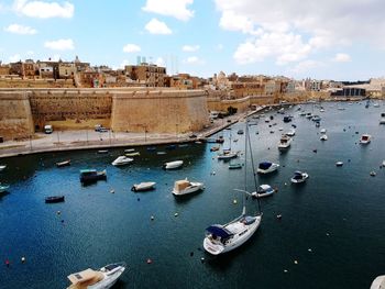 Boats moored in sea