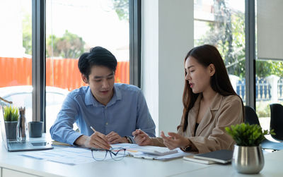 Business colleagues working at office