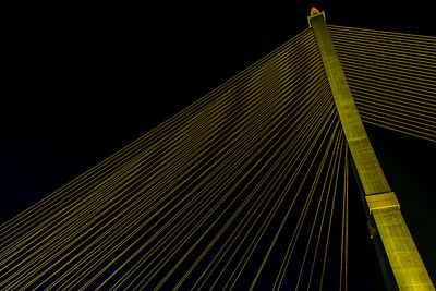 Low angle view of illuminated building against clear sky at night