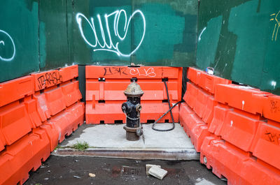 Fire hydrant on street surrounded by barricades