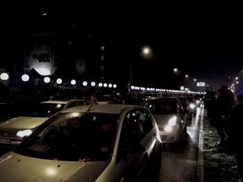 Woman in city at night