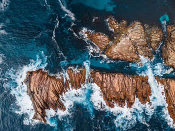 High angle view of rock formation in sea