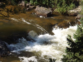 High angle view of water flowing over rocks