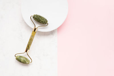 High angle view of bell on table against white background