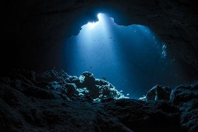 Rays of sunlight into the underwater cave