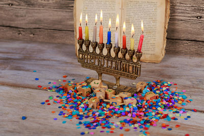 Close-up of colorful candles on table during hanukkah