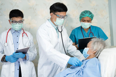 Female doctor examining patient in hospital