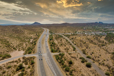 Panoramic view of road passing through landscape against sky