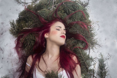 Portrait of young woman looking at camera