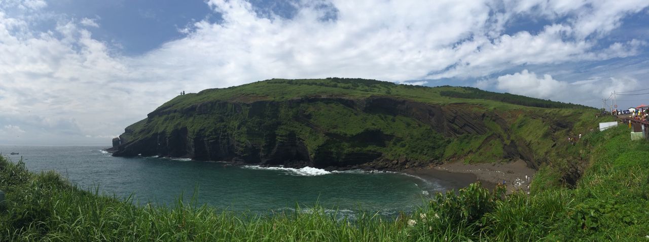 water, sky, sea, scenics, tranquil scene, beauty in nature, tranquility, mountain, nature, grass, cloud - sky, cloud, green color, cliff, coastline, plant, idyllic, rock formation, landscape, day