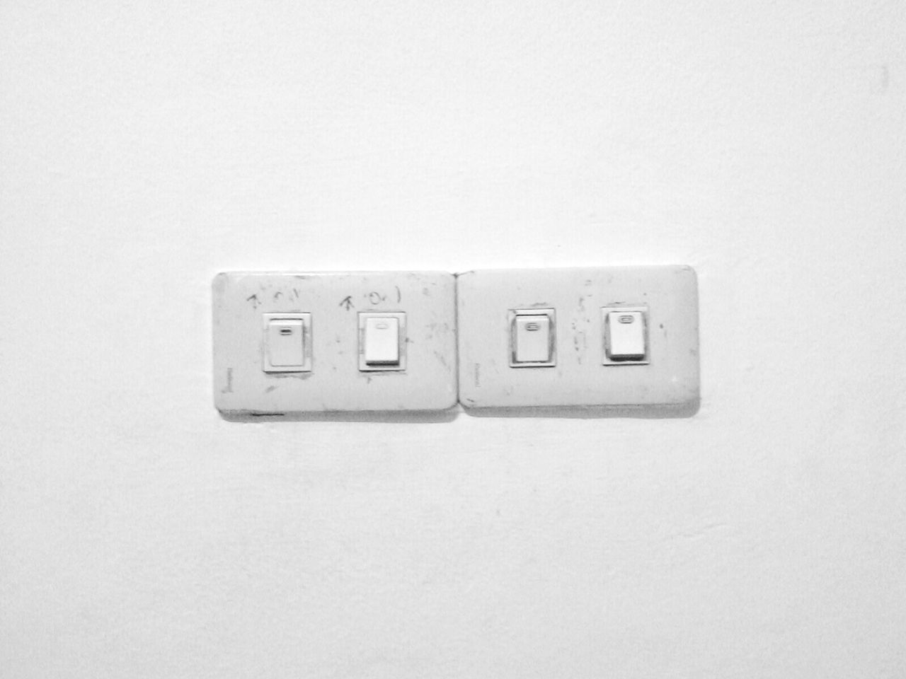 indoors, copy space, studio shot, white background, wall - building feature, communication, close-up, still life, single object, technology, wall, white color, connection, white, no people, number, cut out, simplicity, metal, man made object