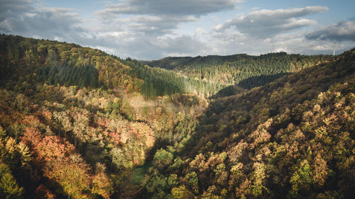 Scenic view of landscape during autumn against sky