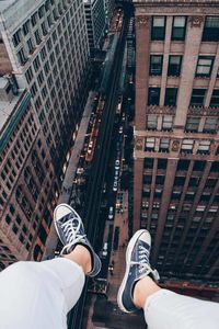 Low section of man over road in city