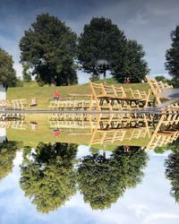 Reflection of trees in lake against sky