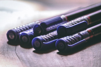 Close-up of pens on table