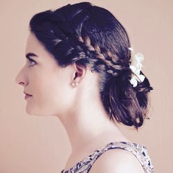 Close-up portrait of young woman over white background