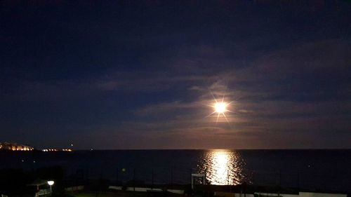Scenic view of sea against sky at night