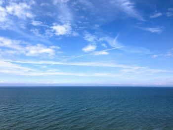 Scenic view of sea against blue sky