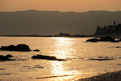 Scenic view of sea against sky during sunset